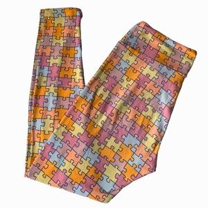 LuLaroe women’s puzzle piece blue, yellow, pink, orange leggings